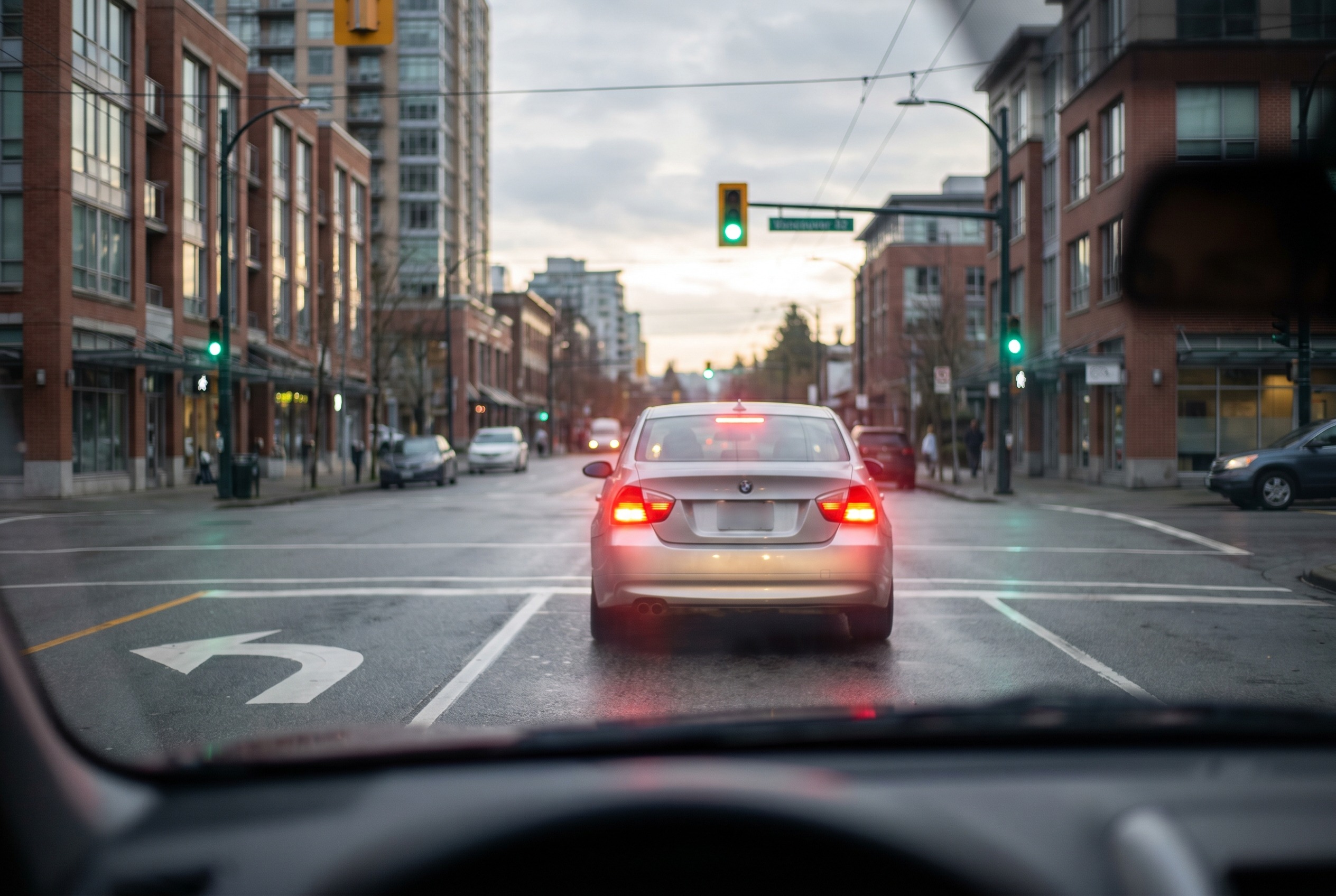You are turning left at a green light. An oncoming vehicle slows down but does not signal. What should you do?